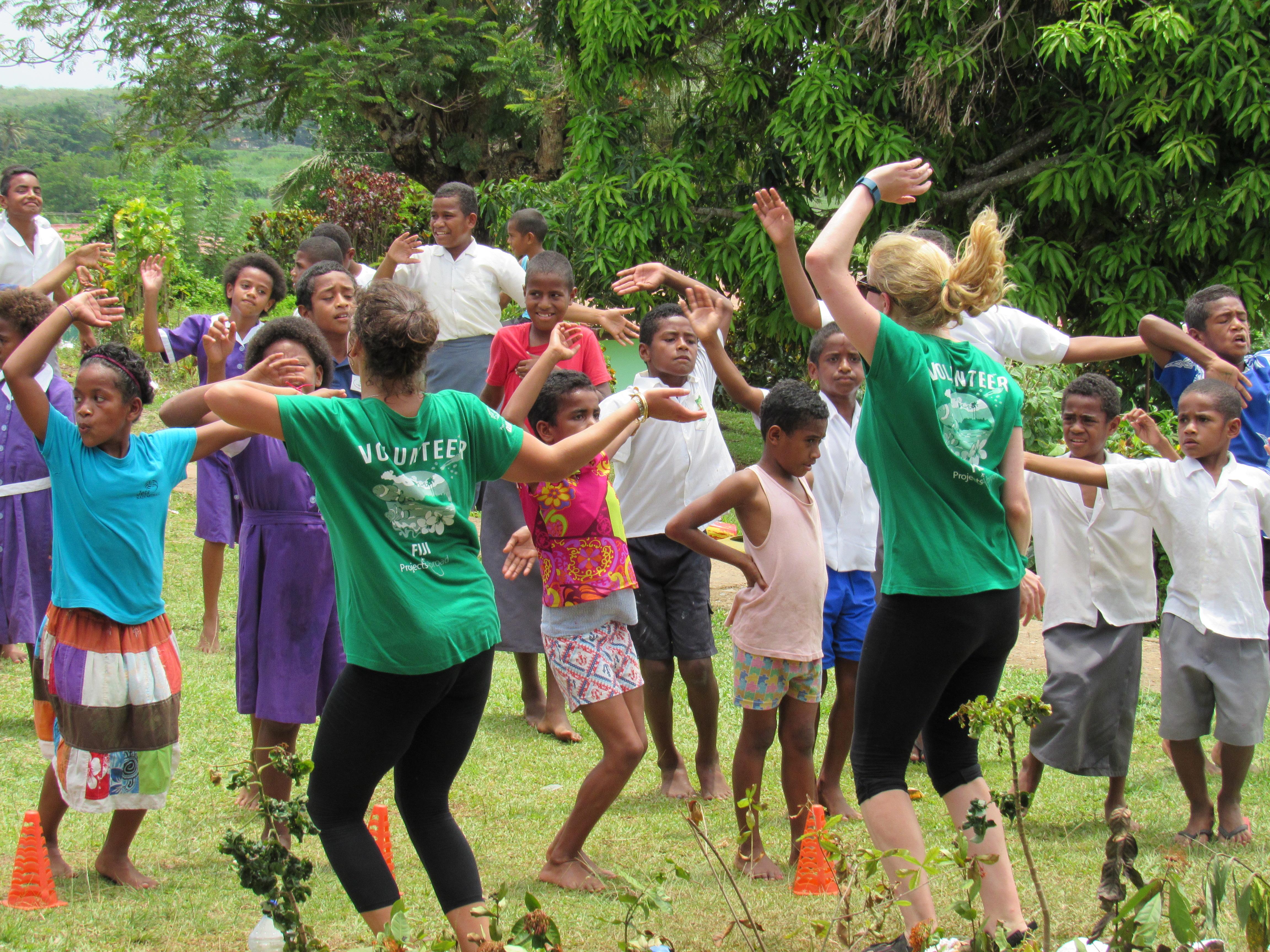 Two interns from Projects Abroad teaching a school class Zumba and promoting exercise whilst on their nutrition internship in Fiji. Two interns from Projects Abroad pictured teaching Zumba to a school class as part of their nutrition internship in Fiji.